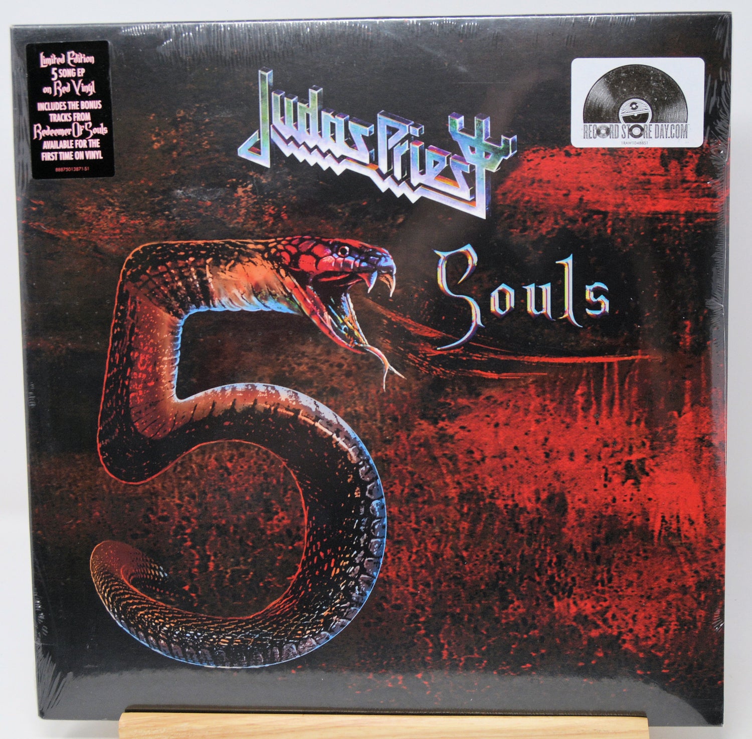 Judas Priest 'Souls 5' limited edition vinyl record LP in its shrink wrap, displayed on a wooden stand against a white background.