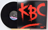 Vinyl record with a red 'KBC' design on the cover