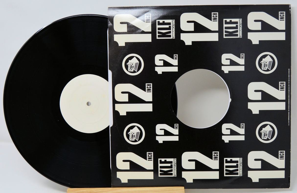 Vinyl record with a black cover featuring 'KLF' logo and text.