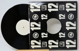 Vinyl record with a black cover featuring 'KLF' logo and text.