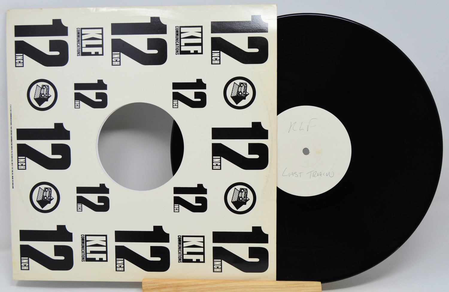 Vinyl record with a cover featuring the number 12 on a white background