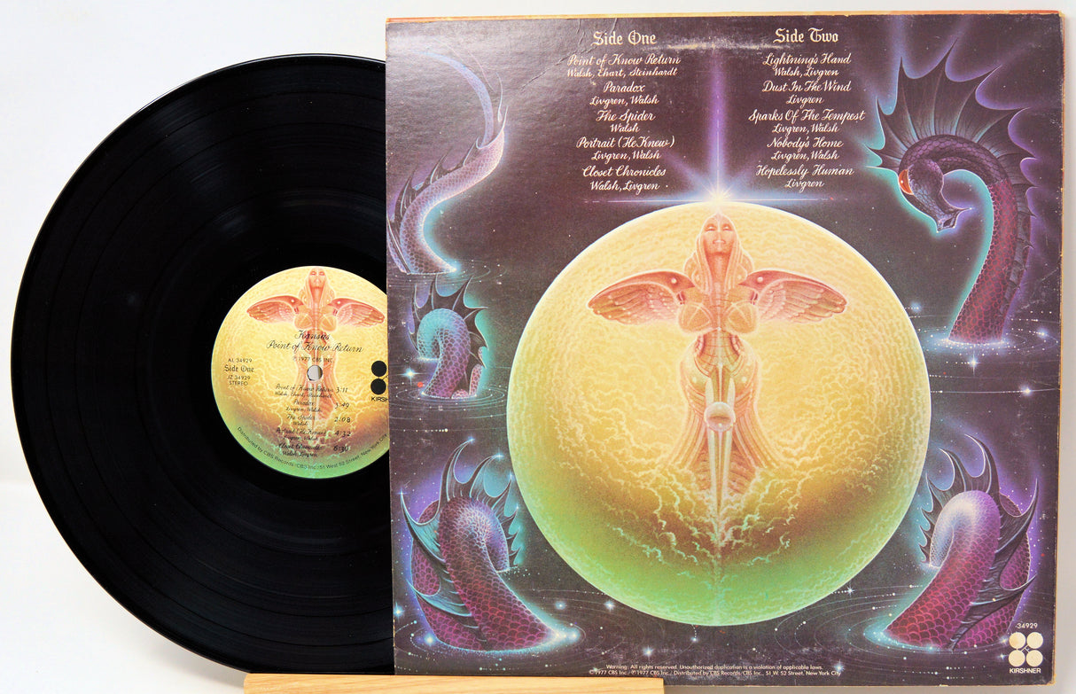 Vinyl record with a colorful, artistic cover featuring celestial designs.