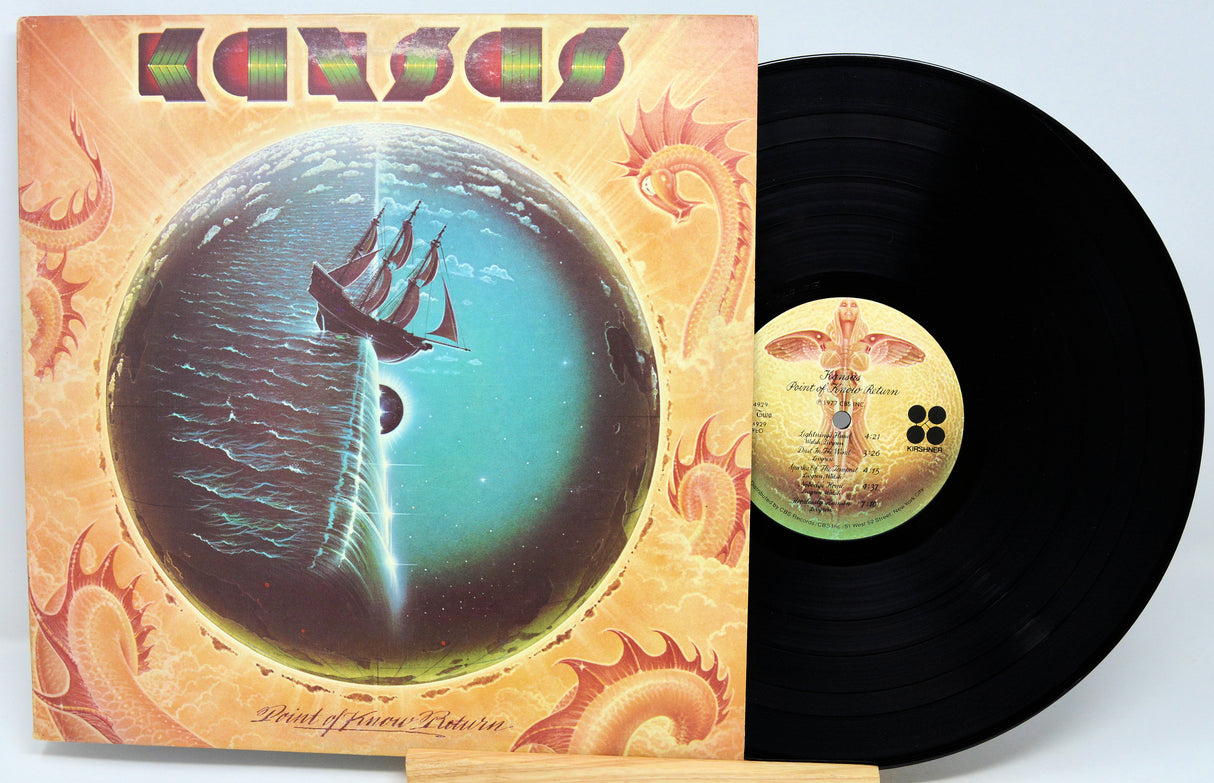 Vinyl record with a colorful cover featuring a ship and celestial design.