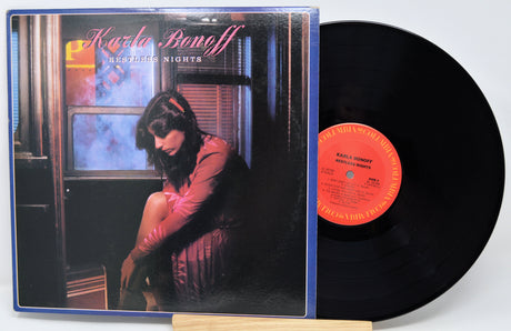 Vinyl record with cover featuring a woman sitting by a window, titled 'Kerrie Bonoff: Midnight Nights'.