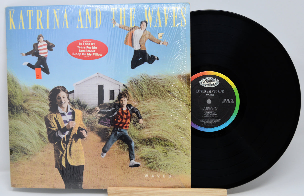 Vinyl record with cover featuring 'Katrina and the Waves' on a white background