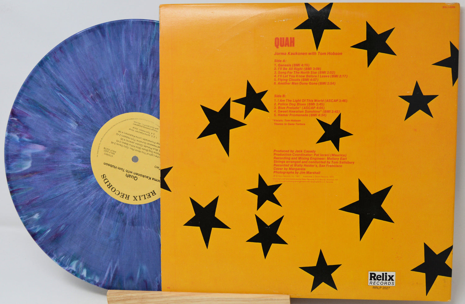 Vinyl record with a blue and purple swirl design on an orange cover with black star patterns, featuring the Relix Records logo.