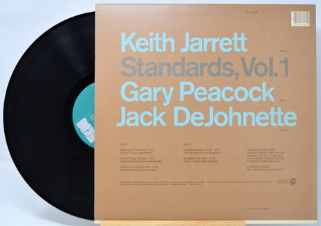'Keith Jarrett Standards Vol 1' Vinyl record and Back cover with blue text on a brown background.