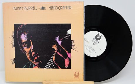 Front cover and vinyl record of Kenny Burrell Handcrafted LP featuring an artistic portrait design