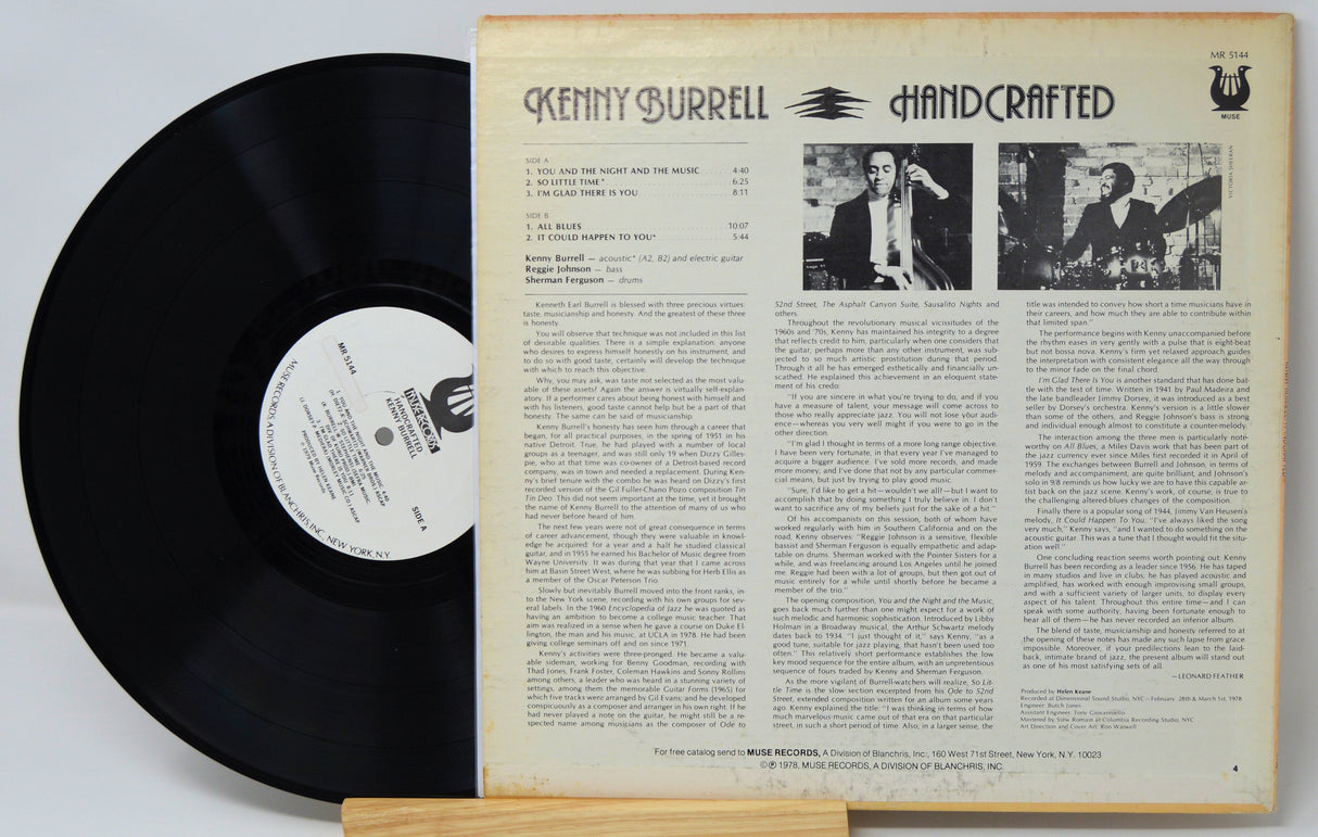 Back cover and vinyl record of Kenny Burrell's Handcrafted LP with liner notes and tracklist visible