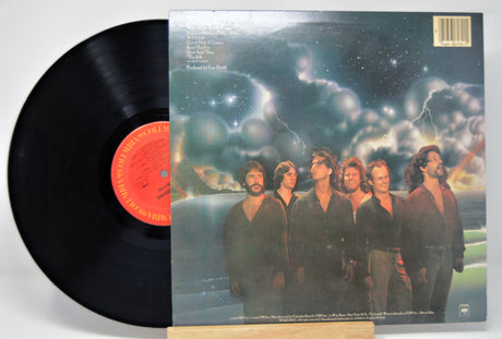 'Kenny Loggins Keep The Fire' Vinyl record with a colorful album cover featuring six band members.