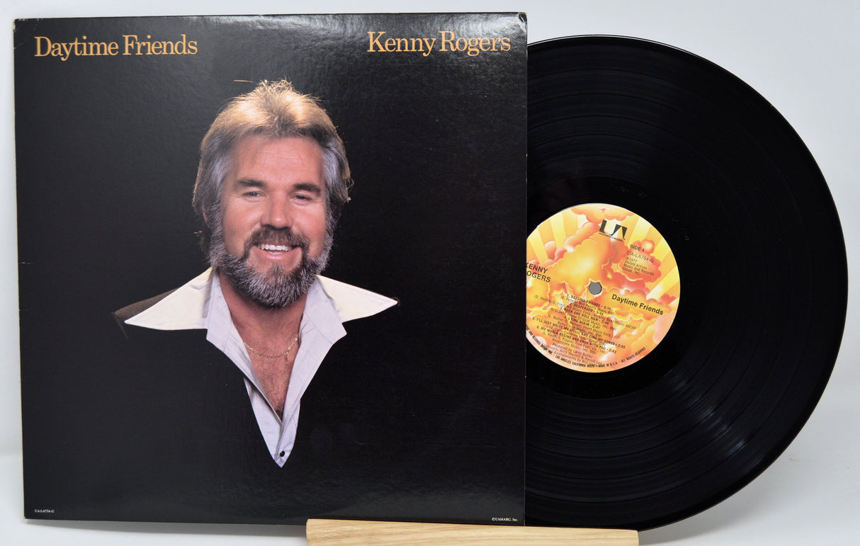 Front cover of Kenny Rogers Daytime Friends LP with smiling portrait and record