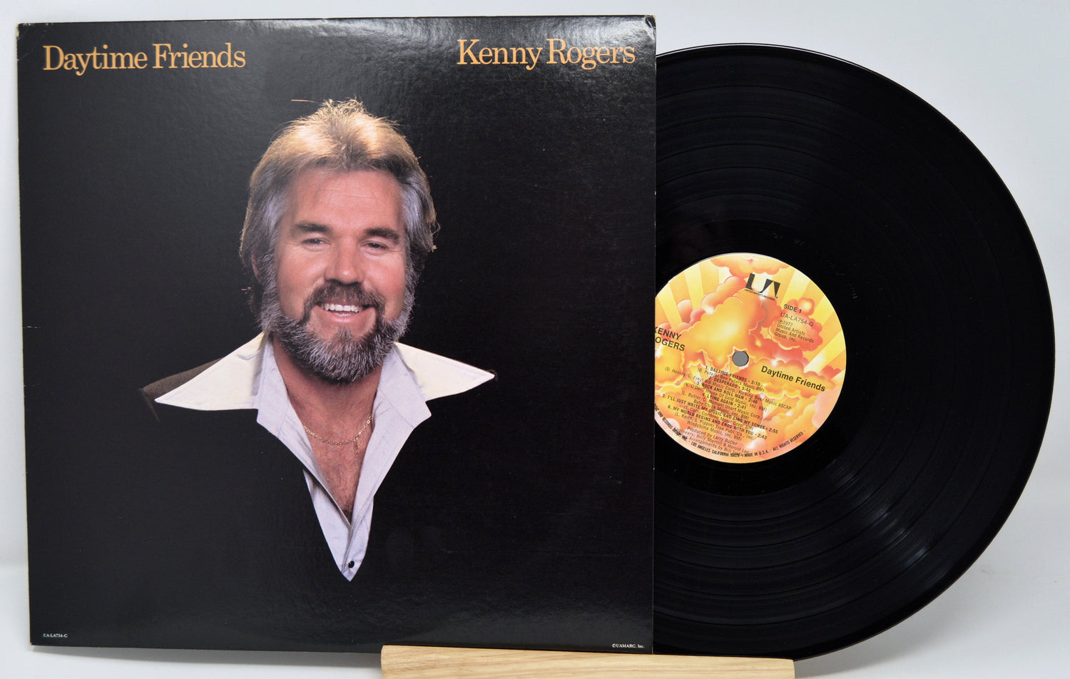 Front cover of Kenny Rogers Daytime Friends LP with smiling portrait and record