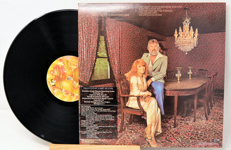 Back cover of Kenny Rogers and Dottie West's 'Every Time Two Fools Collide' vinyl LP showing the artists in a vintage dining room