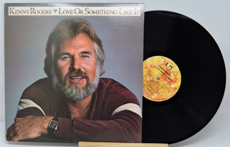 Front cover of Kenny Rogers' 'Love Or Something Like It' vinyl record album with fold out sleeve