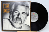Vinyl record with cover featuring a black and white portrait of a man, labeled 'Kenny Rogers'.