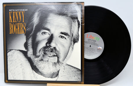 Vinyl record with cover featuring a black and white portrait of a man, labeled 'Kenny Rogers'.