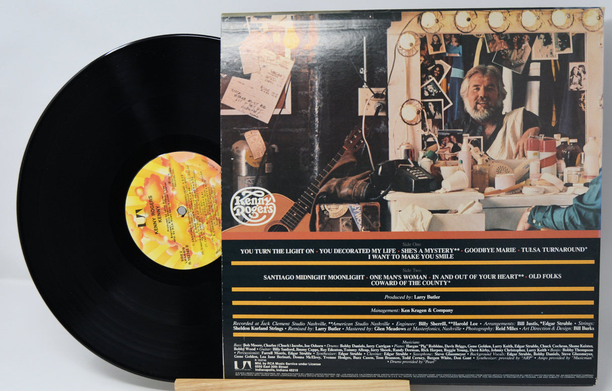 Back cover and vinyl record of Kenny Rogers' album with tracklist and dressing room scene