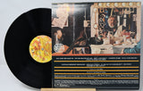 Back cover and vinyl record of Kenny Rogers' album with tracklist and dressing room scene