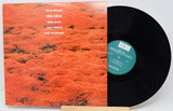 Vinyl record with 'Pink Floyd Works' album cover on a white background