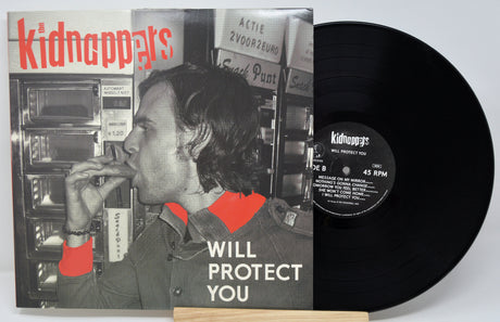 Vinyl record with cover featuring a person and text 'kidnappys' on a white background