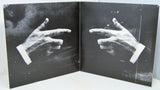 Black and white album gatefold artwork showing two hands in pointing gesture