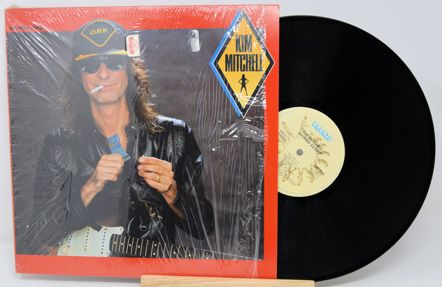 Vinyl record with a cover featuring a person and a prominent label on a white background