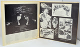 Open book with black and white images and text on a white background