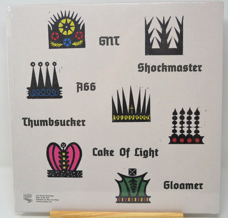 Back cover of 'King of Cowards' LP featuring stylized crown illustrations and tracklist names