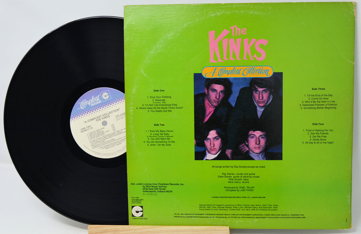Vinyl record with green cover featuring The Kinks album art on a white background