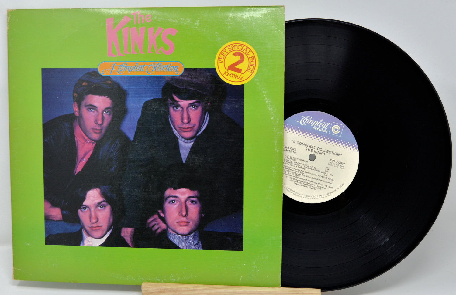 Vinyl record with green cover featuring a band portrait and 'The Kinks' branding.