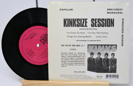 Vinyl record with pink label and Kinks album cover on a white background