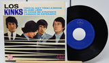Vinyl record with blue label and cover featuring a band on a white background