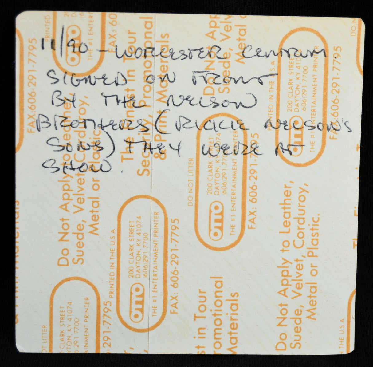 Back side of Kiss backstage pass with handwritten notes on it.
