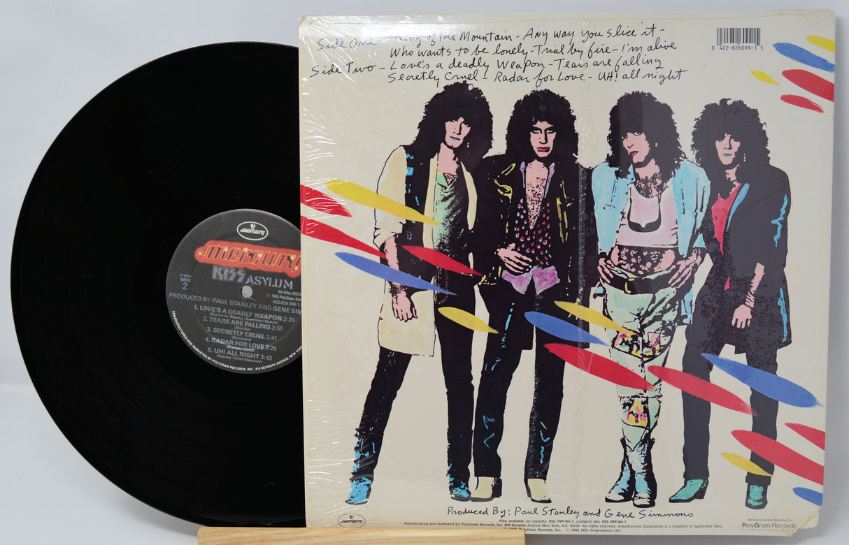 Vinyl record with a colorful cover featuring four band members.