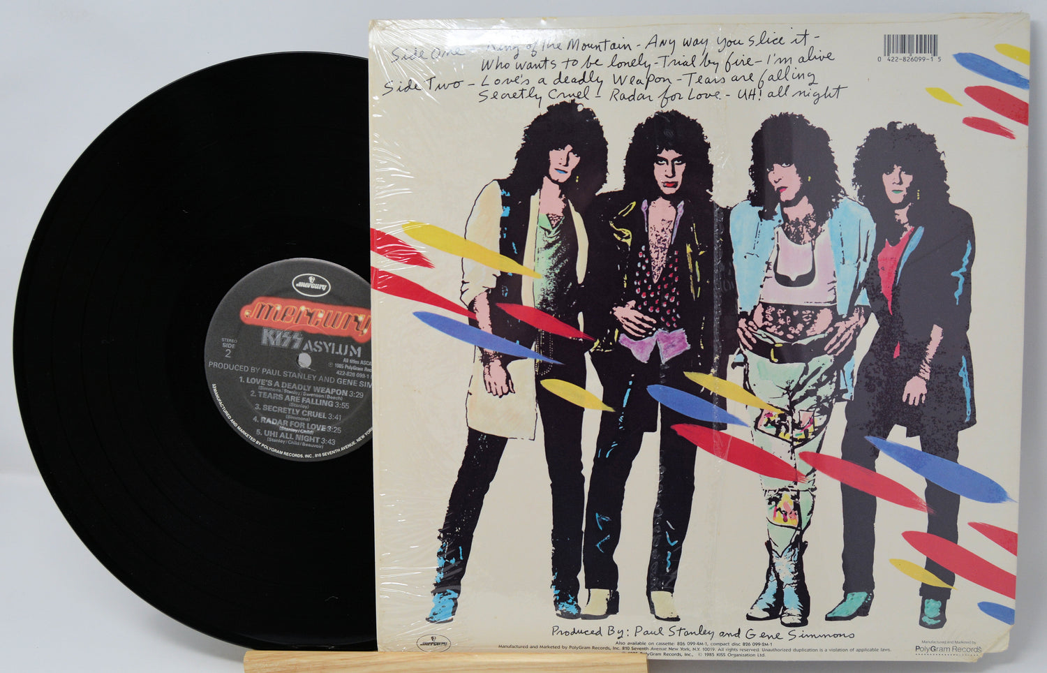 Vinyl record with a colorful cover featuring four band members.