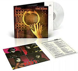 A vinyl record titled 'Kiss - Music from the Elder' with an image of a hand holding a large, gold-colored ring on a dark, wooden door.