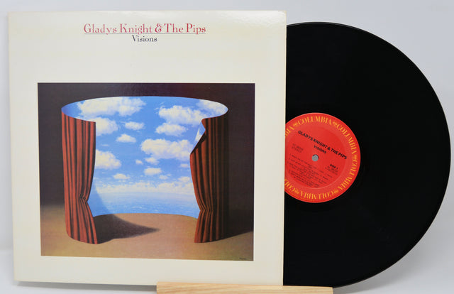 Vinyl record and cover with 'Gladys Knight & The Pips' album art on a white background