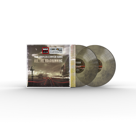 Colored vinyl records with cover showing a street scene.