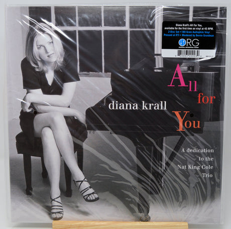 Diana Krall's 'All for You' vinyl record cover, sealed in plastic shrink wrap. The cover features a black-and-white photograph of Diana Krall sitting at a grand piano, with the title 'All for You' in white and coral-pink text.
