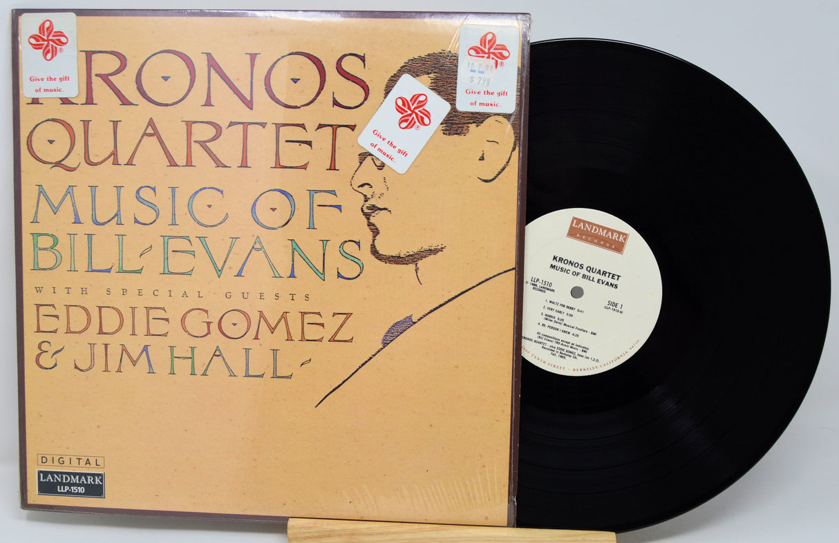 Vinyl record with a blue cover featuring text and images on a light gray background
