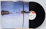 Vinyl record with cover featuring a snowy landscape and 'Kyuss' branding.