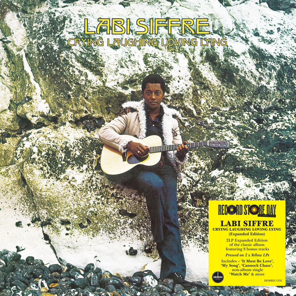 Album cover featuring a person playing guitar on rocks with text 'Labi Siffre Crying Laughing Loving Lying'.