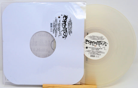 Vinyl record with a clear label and white sleeve on a white background