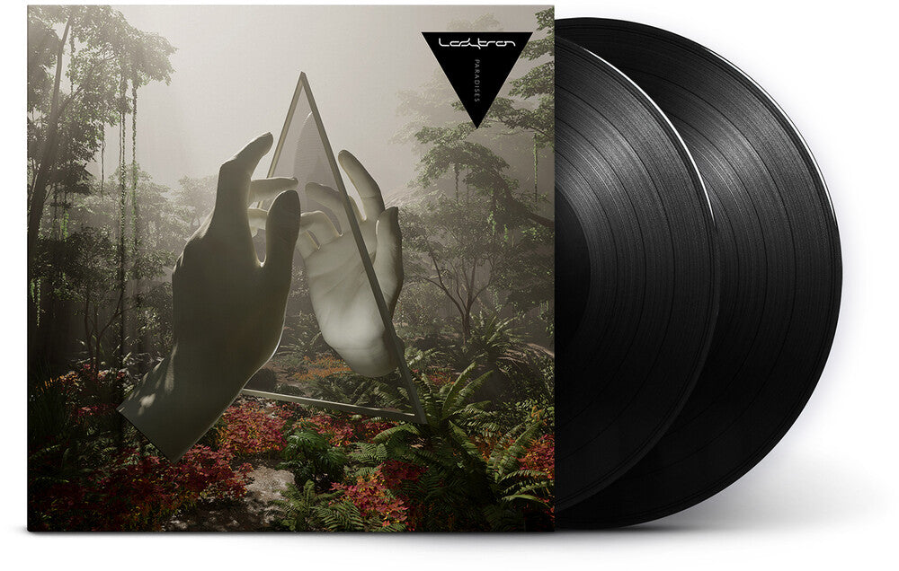 Vinyl records with a forest-themed cover featuring hands and a triangle shape.
