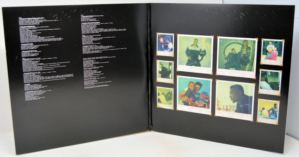 Vinyl cover featuring people sitting at a table with their eyes black out by a black bar