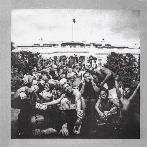 Black and white photo of a group of people in front of a building with a flag.