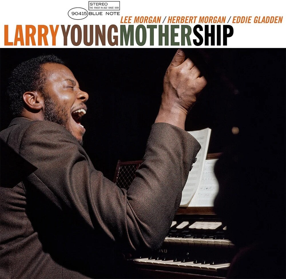 Album cover of 'Mother Ship' by Larry Young featuring a photo of him playing piano with a raised hand.