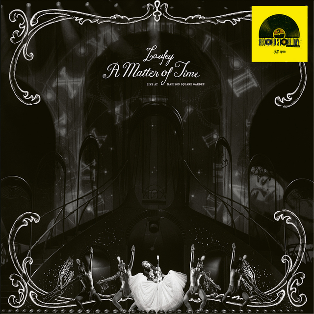 Album cover with dancers and text 'A Matter of Time' on a dark background