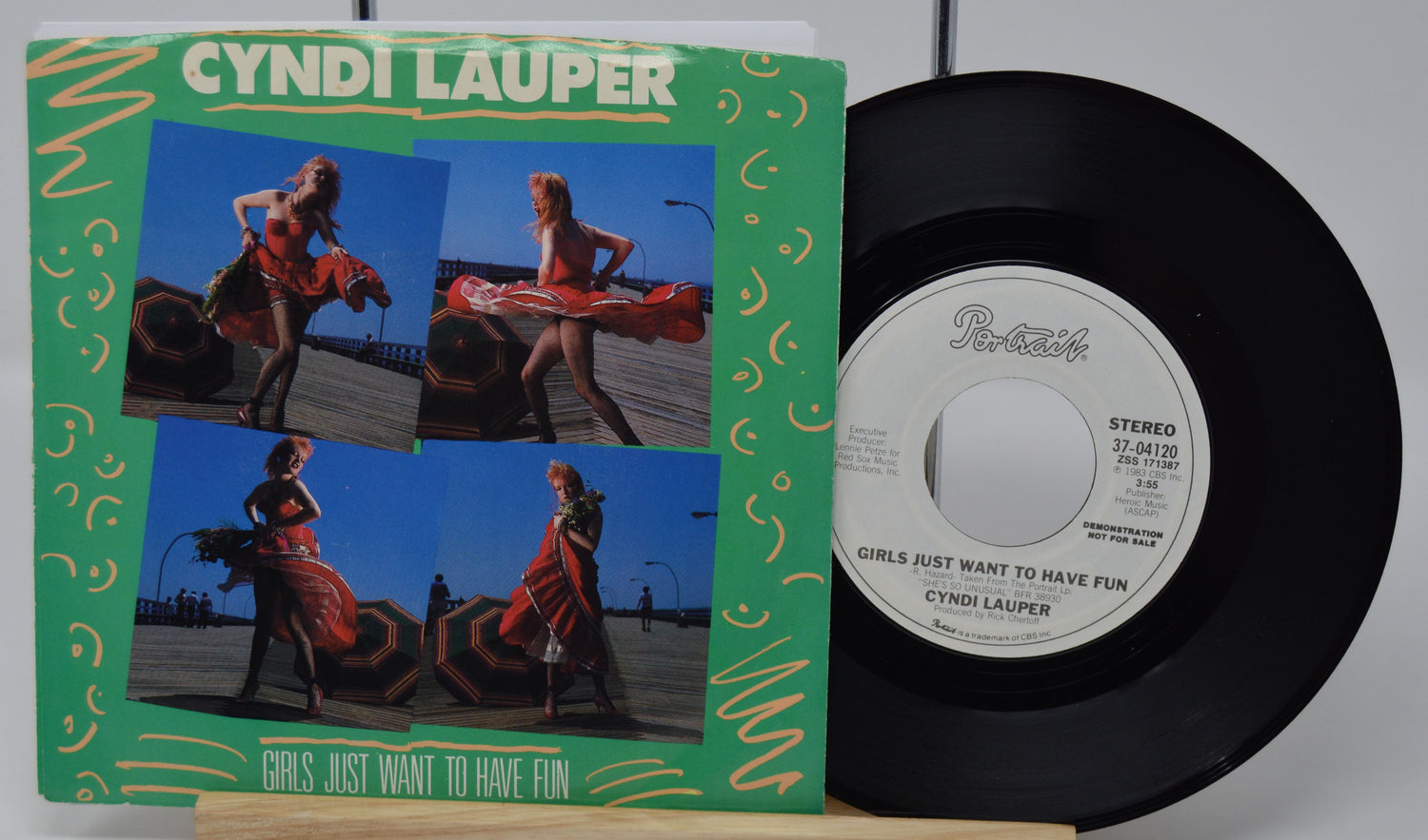 Vinyl record and cover with 'Cyndi Lauper' on a white background