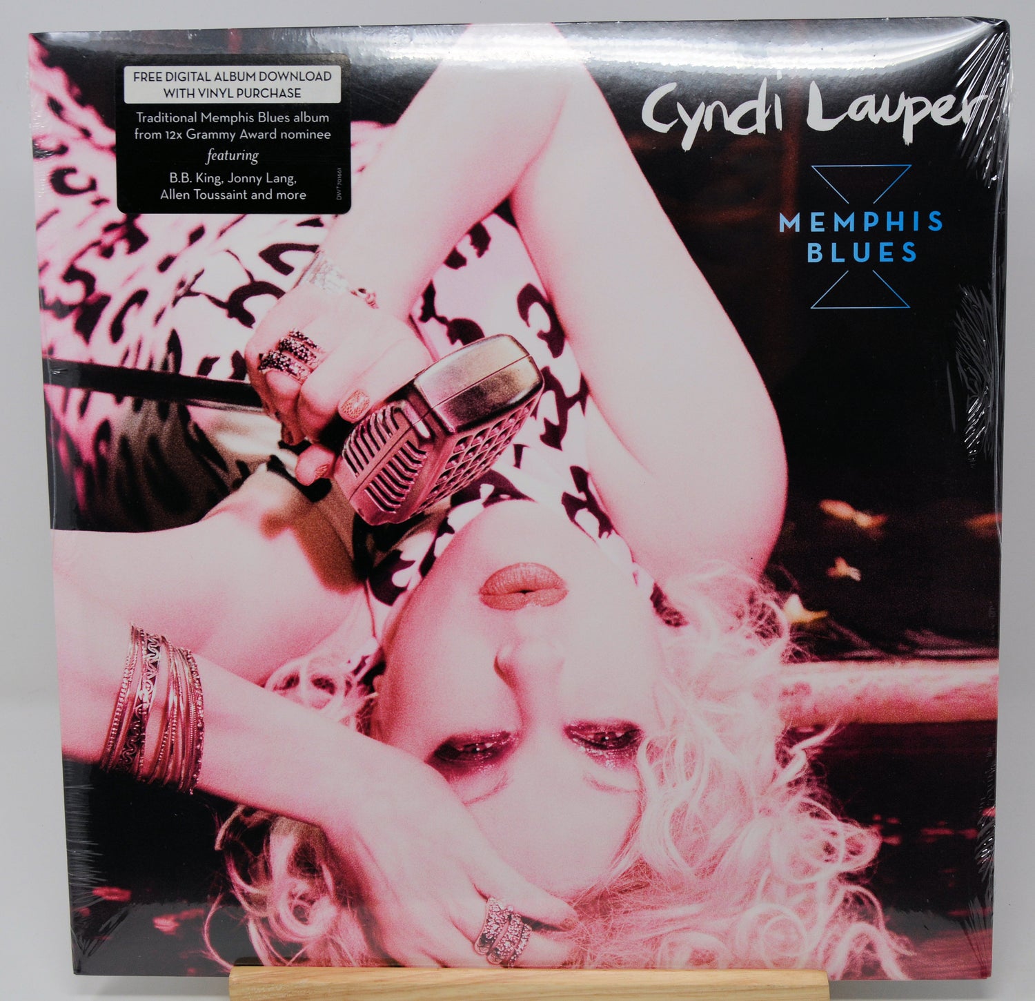 Vinyl record cover featuring a person with a microphone, with 'Cyndi Lauper Memphis Blues' text.